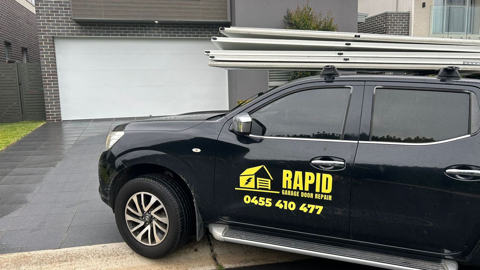 Rapid Garage Door Repairs vehicle parked at a client’s door, ready for garage door service and repairs in Sydney